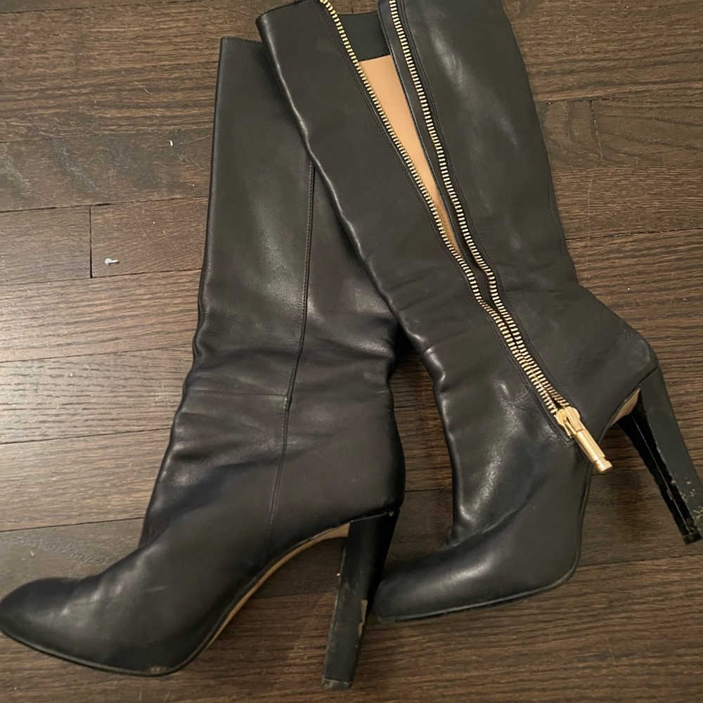 Banana Republic black boots with gold zipper.